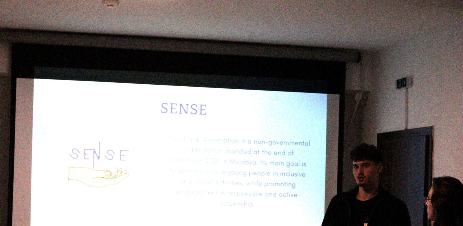 The SENSE team presenting Moldova, next to the projected SENSE slide.