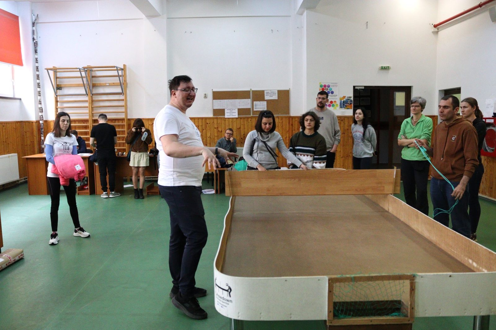 The Showdown table with an instructor explaining the game to the group.